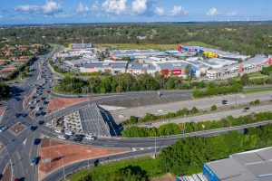 Drone video of the Homeworld Helensvale shopping centre flying along side the M1 motorway