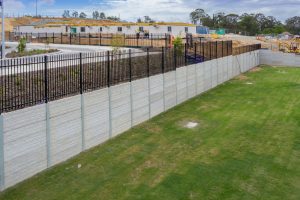 Drone photograph of a sleeper wall under construction at a state school under development at Coomera